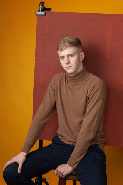 istock Studio portrait of 20 year old blond man 1298016169