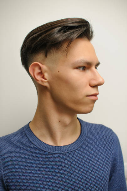 istock Young man with modern short haircut 1298018030