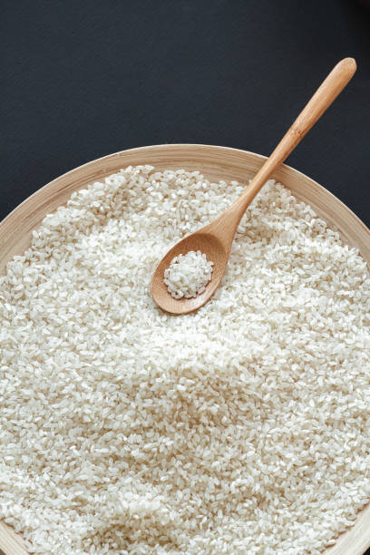 istock White round rice in wooden or bamboo spoon 1298018728