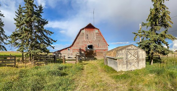 A rustic and weathered farmhouse barn outside of Olds Alberta