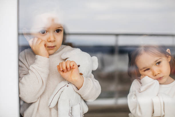istock Little Girls Self-Isolation At Home 1298020656