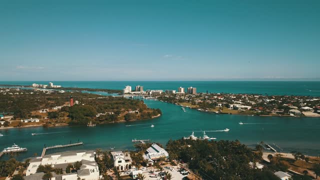 Winter Weekend Aerial Views of Boating on the Teal Ocean Water of the Jupiter Inlet in Jupiter, Florida at Mid-Day in January of 2021