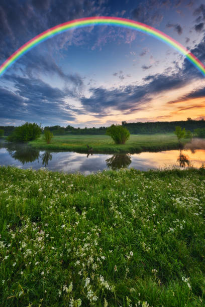 istock Landscape with a Rainbow on the River in Spring. colorful morning 1298021596