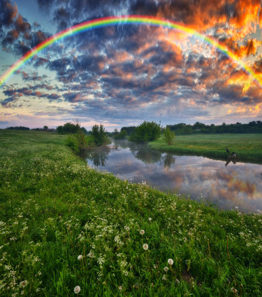 istock Landscape with a Rainbow on the River in Spring. colorful morning 1298021608