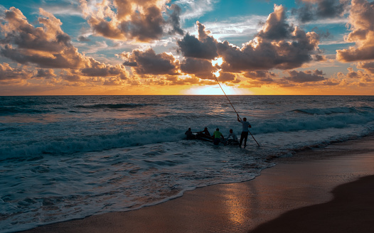 Ipojuca district, Pernambuco state, Brazil - January 17, 2021:Fishermen working in the morning.
