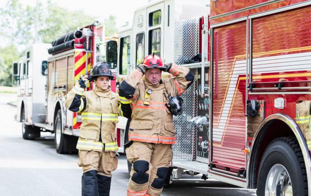 istock Firefighters in fire protection suits ready for action 1298023360
