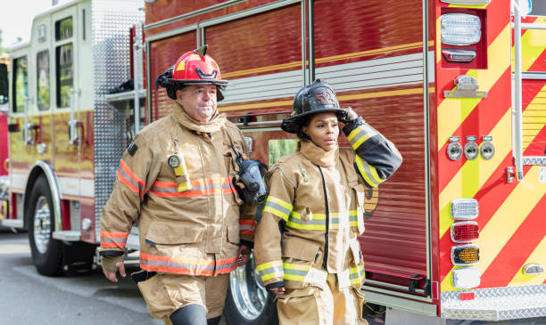 istock Firefighters in fire protection suits ready for action 1298023377