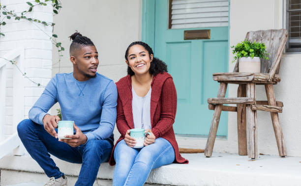 istock African-American couple hanging out, drinking coffee 1298023715