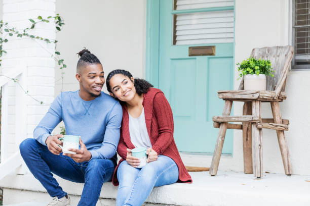 istock African-American couple hanging out, drinking coffee 1298023718