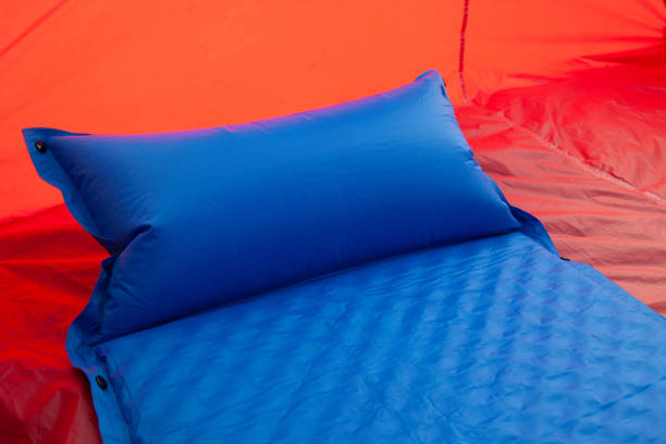A blue self inflating blow-up mattress pad stock photo