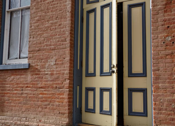 istock Open Door in Brick Building 1298027884