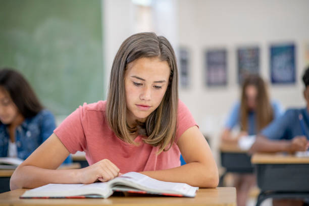 istock High school student reading at her desk 1298031501