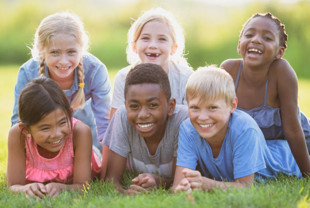 istock Multi ethnic group of children outdoors 1298031532