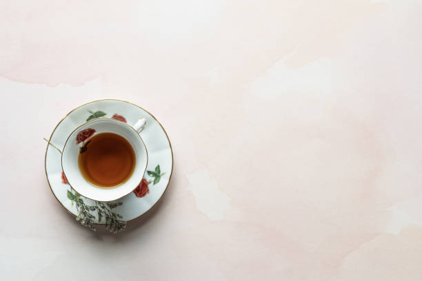 istock Tea Cup and Saucer on a Watercolor Background 1298031690