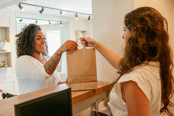 istock Two women in a shoes store 1298032399