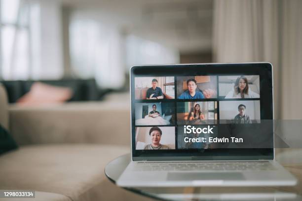 Laptop Screen Showing 8 Asian Chinese Face Video Conference In Aiport Departure Business Lounge Sofa Stock Photo - Download Image Now