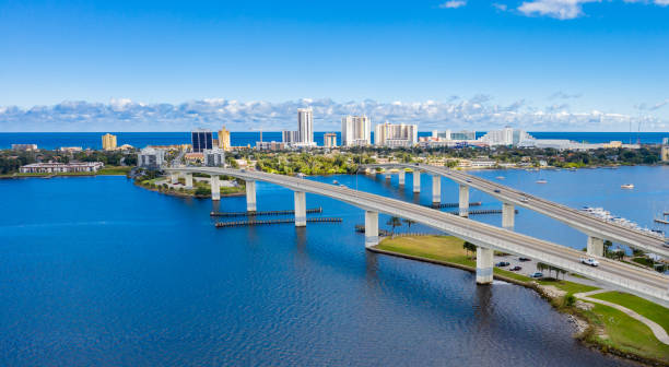 Daytona Beach Florida Skyline Aerial View Drone angle view of Daytona Beach skyline and bridges over the intracoastal waterway. florida beach above stock pictures, royalty-free photos & images