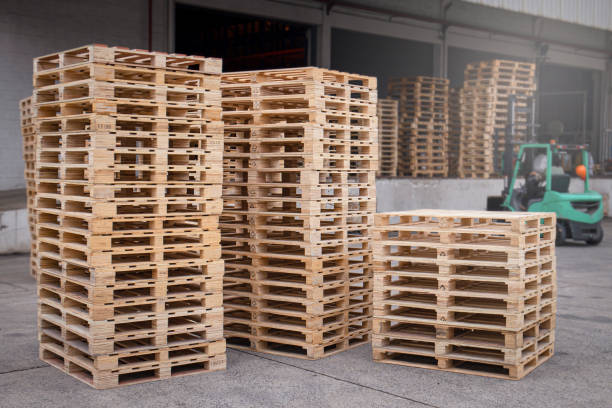 istock Stack of wooden pallets rack at warehouse storage. 1298048021