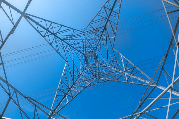 power line during day time with blue sky
