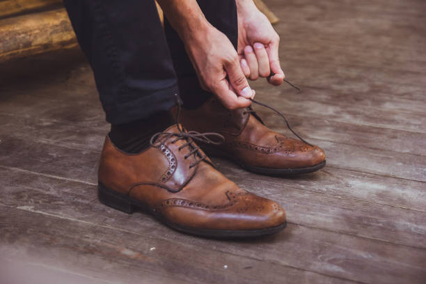 istock a groom and brown wedding shoes 1298050877