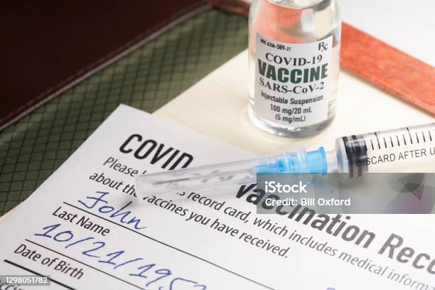 Covid19 Vaccination Record Card With Syringe And Vial Stock Photo - Download Image Now
