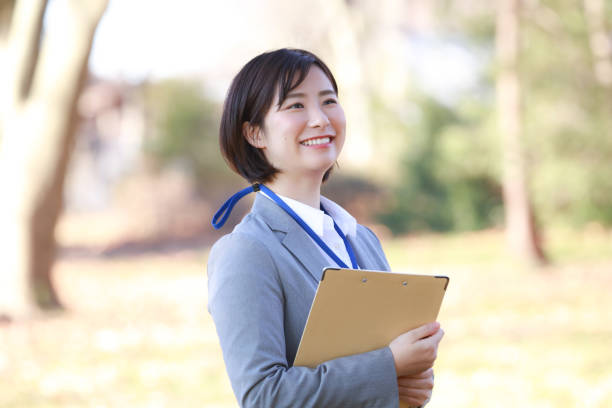 istock Female employee with a binder 1298053413
