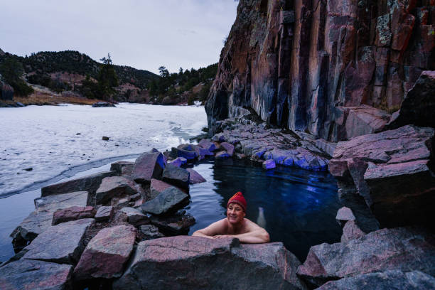 istock Man Soaking in Outdoor Hot Springs 1298053474