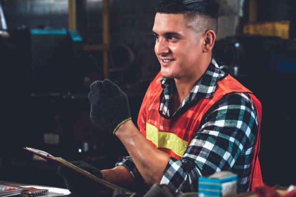istock Smart factory worker or engineer do machine job in a manufacturing workshop 1298059773