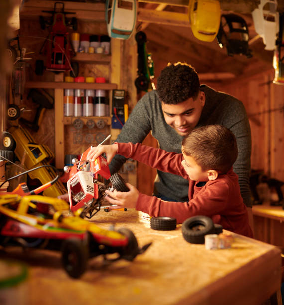 istock dad and son in the shed 1298062003