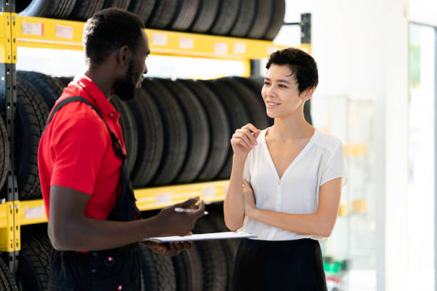 istock A mechanic talking to female customer 1298063011