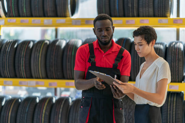 istock A mechanic talking to female customer 1298063157
