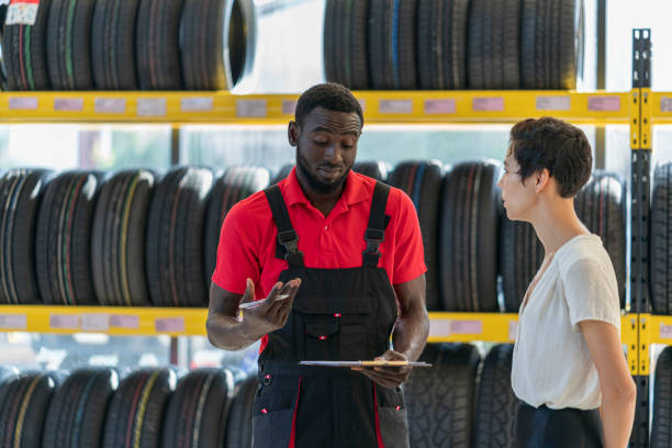 istock A mechanic talking to female customer 1298063202