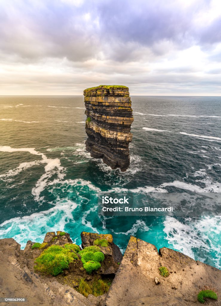 Downpatrick head The iconic sea stack off the west coast of Mayo in Ireland at sunset Downpatrick Stock Photo
