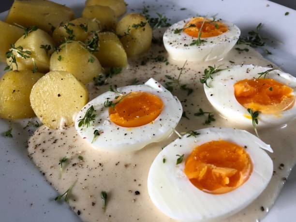 istock Sour eggs with mustard sauce salt potatoes cress watercress 1298065417