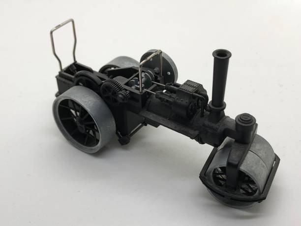 istock small toy steam roller steam engine made of metal 1298066907