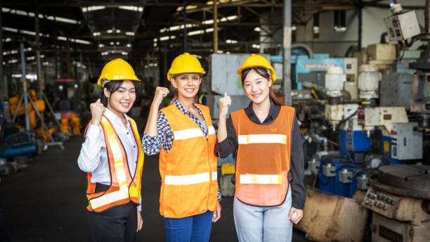istock Female mechanical engineer with hard hats in a factory 1298069333