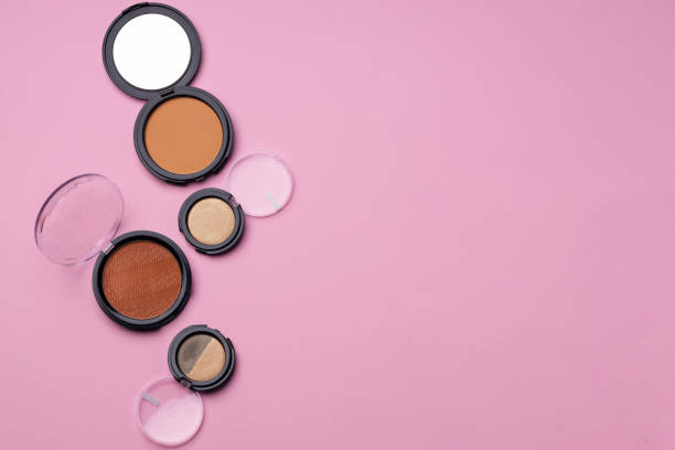 istock Set of eyeshadows make up products on pink 1298071825