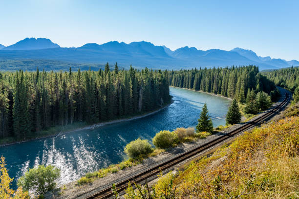 istock Bow River flows through forest and railway track. Storm Mountain in the background. Castle Cliff Viewpoint, Banff National Park 1298072861