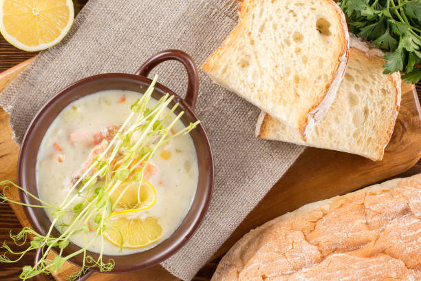 istock Delicate soup with salmon in a saucepan for serving. Restaurant concept. Still life. 1298073777