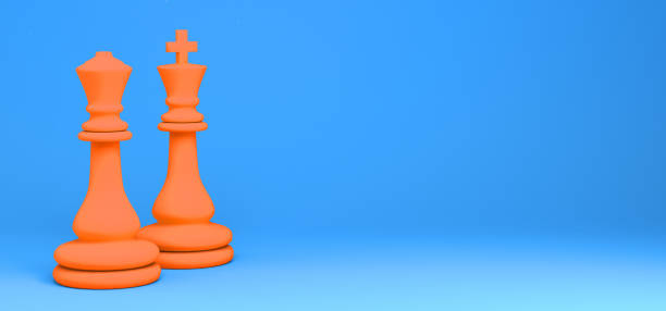 istock Chess pieces. Orange king and queen on blue background. 3D illustration. Abstract. 1298073821