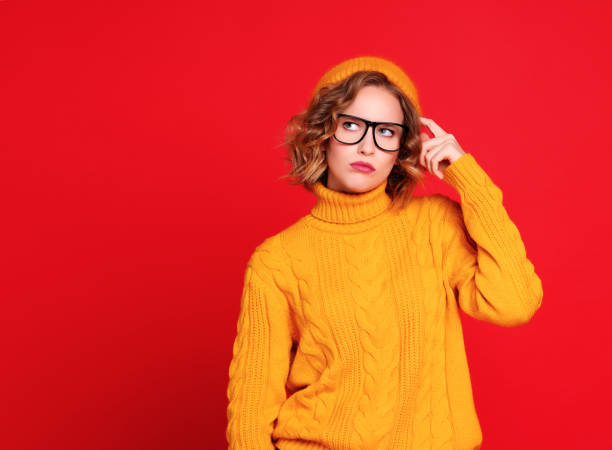 istock Thoughtful young female looking up 1298074957