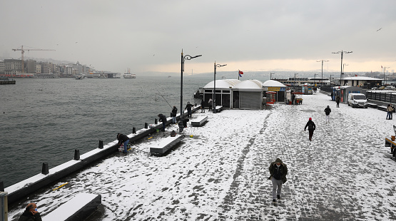 Istanbul, Turkey - January 18, 2021: Snowy street in Eminonu District. The first snow in Istanbul after 3 years.