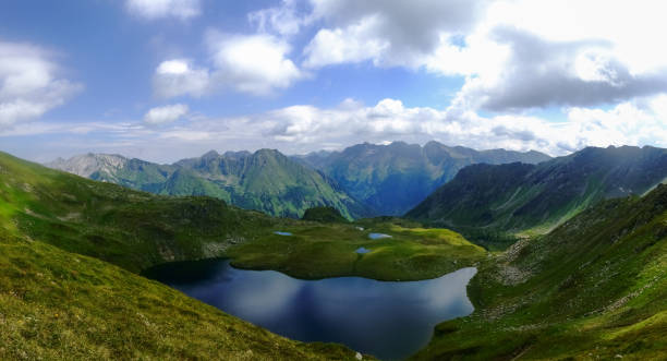 istock wonderful blue mountain lakes in a mountain landscape while hiking panorama 1298077604