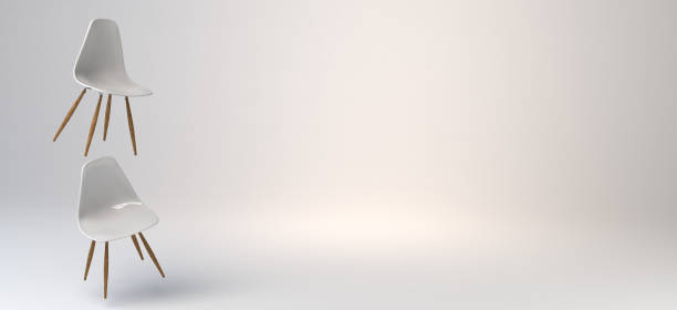 istock White chairs floating on white background with wooden legs. Banner. 3d illustration. 1298078443