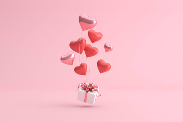 istock Mock up of gift box with balloons in heart shape. 3d rendering. 1298083973