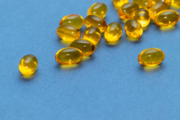 istock Capsules fish oil yellow sleep blue background 1298085299