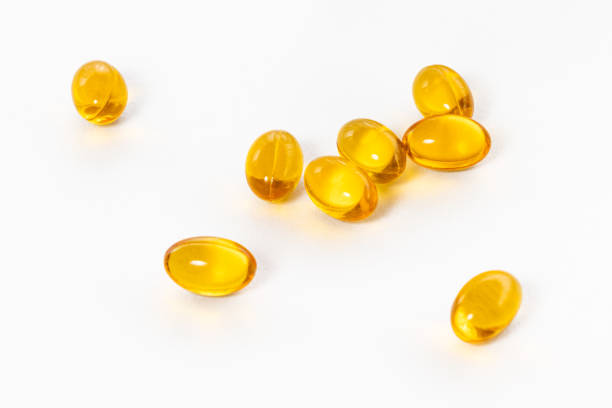 istock Capsules fish oil yellow sleep white background 1298085447