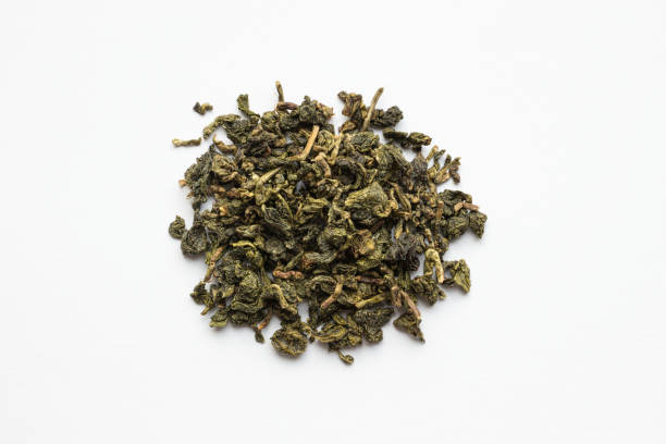 istock Green loose tea on a white background. Top view 1298085655