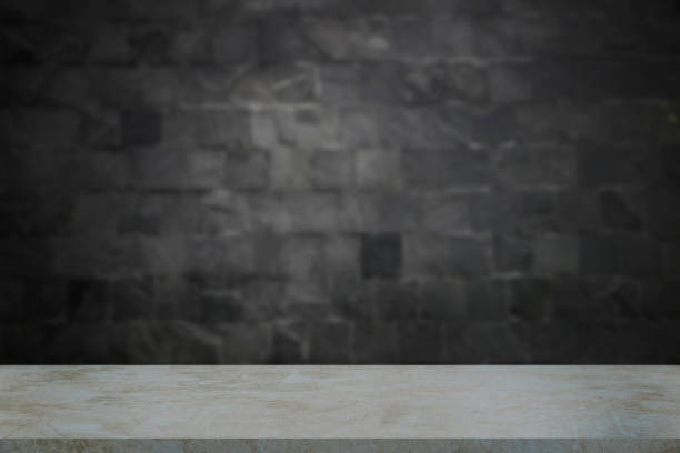 istock Marble shelves isolated on blurred black stone wall background, For product display 1298085940