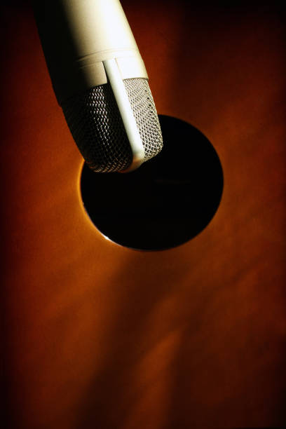 istock Condenser microphone and cajon drum ready for recording music beat. 1298088304
